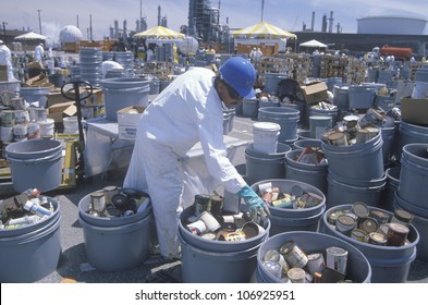 CIRCA 1990 - Worker Sorting Toxic Wastes At Waste Cleanup Site On Earth Day At The Unocal Plant In Wilmington, Los Angeles, CA