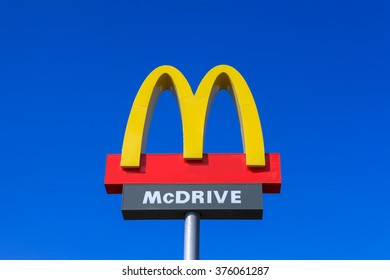 Circa, Circa - February 11, 2016: Classic McDonald's sign with blue sky. McDonalds is the world's largest chain of hamburger fast food restaurants, serving around 68 million customers daily