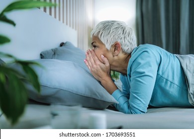 Circadian Rhythm Sleep Disorder. Worried Mature Woman In Bed Staying Awake Late At Night