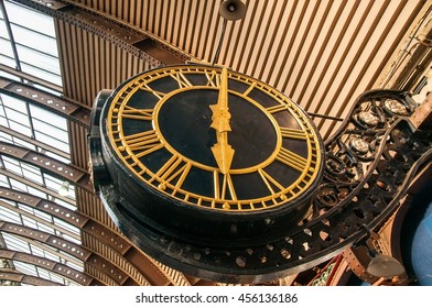 A circle clock shows time about 6 oâ??clock