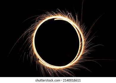 Circle Drawing Light Fireworks. Burning Flare Or Flame With Bright Sparks On Background With Copy Space. Long Exposure Light Painting