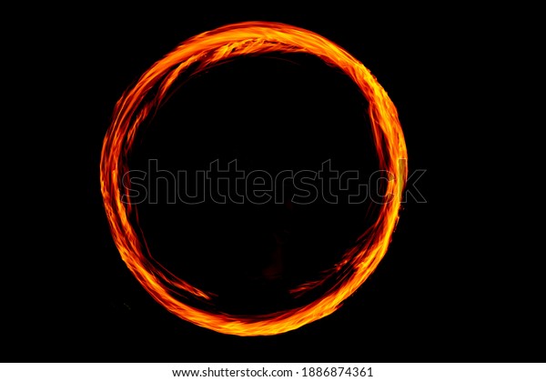 Circle of Fire flame with movment isolated on\
black isolated background - Beautiful yellow, orange and red and\
red blaze fire flame texture\
style.