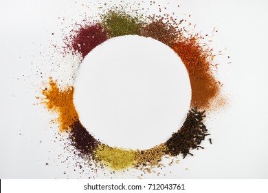 Circle frame composition of spices and herbs isolated on white background with copy space. Frame of Indian spices and herbs. Ingredients of asian cuisine spices - Powered by Shutterstock