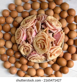 A Circle Of Large Natural Pink Beige Colored Roses Surrounded By Brown Eggshells, In A Circular Overhead Photo.