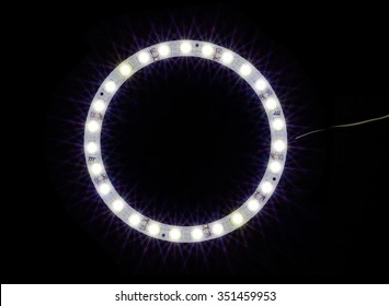 Circle Led Light Bulb Over Black Background