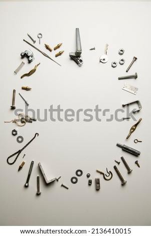 A circle made of silver odds and ends isolated on a white background