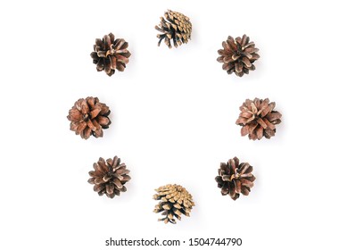 Circle Of Pine Cones On A White Background. Natural Christmas Composition. Holiday Card. Flat Lay. View From Above