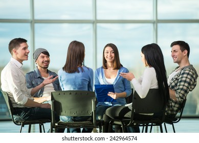 Circle of trust. Group of people are sitting in circle and supporting each other. - Powered by Shutterstock