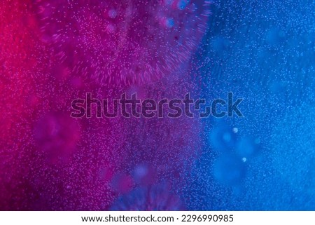 Circles on the water. Oil stains. Spilled fuel. Oil in water. Gasoline in water. Liquid like oil. Bubbles in the water of different colors and sizes. Red, blue, purple and green.