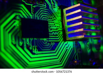 Circuit board. Electronic computer technology. Close up with blue glowing.