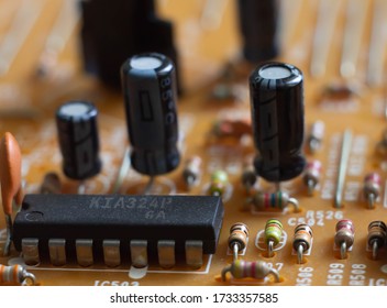 Circuit board with radio components (resistors, capacitors, microcircuits) close-up