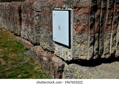 circuit breakers and the main switch is embedded in a stone block. the difficult solution of placing such a cabinet evokes astonishment and an impression of futility.