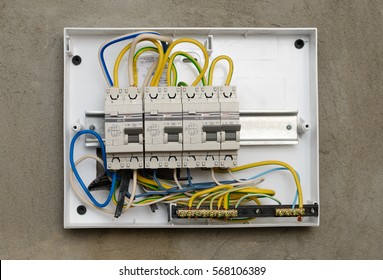 Circuit Breakers In A Plastic Box On A Wall