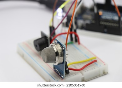 Circuit creation with electronic components on a breadboard, Prototype of gas leakage detection project using MQ2 sensor and buzzer