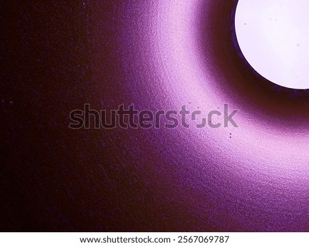 A circular abstract gradient with soft pink and white tones, resembling a glowing lunar effect.