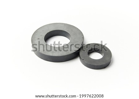 Circular black ferrite ring shaped magnets isolated on a white background
