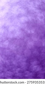 Circular bokeh effect with blurred, overlapping light patterns on a purple background. The soft, unfocused circles create a dreamy and abstract visual texture, emphasizing the interplay of light and color.