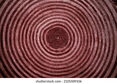 The circular ceiling of a chapel with red and white stones. - Powered by Shutterstock