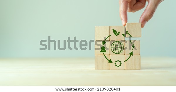 Circular economy concept, recycle,\
environment, reuse, manufacturing, waste, consumer, resources. LCA\
Life cycle assessment. Sustainability Wooden cubes; symbol of\
circular economy on grey\
background.