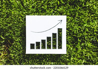 circular economy and sustainable development increasing in popularity conceptual image, graph with positive growth statistics on green grass with cut outs - Shutterstock ID 2201066129