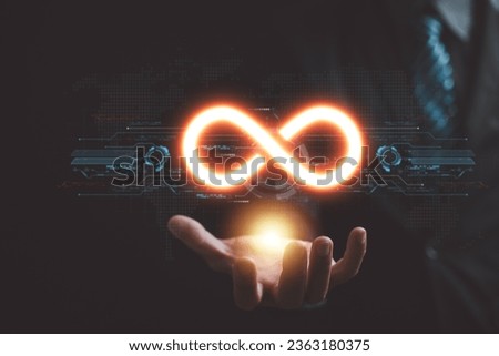 Circular infinity symbol held by businessman, illustrating circular economy and infinite opportunities. Strategy of sustainable investment, banking, and financial growth. technology infinity data