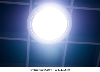 A Circular Light Bulb On The Blue-blue Ceiling