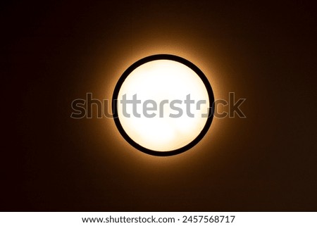 circular light on the ceiling in a dark room