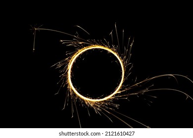 Circular Lights With Sparks On A Black Background