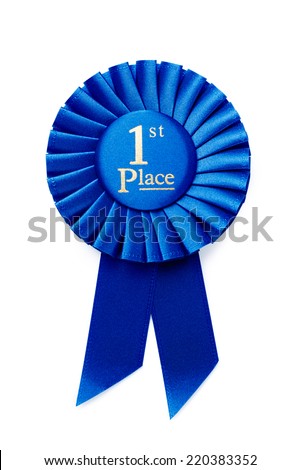 Circular pleated blue ribbon winners rosette with central text - 1st Place - in gold, isolated on white