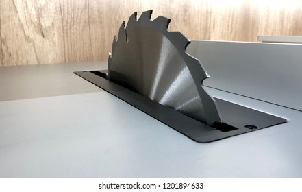 Circular saw cutting wooden plank. Blade circular saws. Circular saw close-up. Woodworking circular saw. Working equipment carpentry workshop. - Powered by Shutterstock