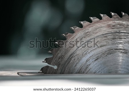 Circular saw. Detail of worn circular saw teeth. Saw after cutting wood. Wear of the working tool. Dull and dirty cutting tool, saw blade. Blunt instrument, Sharp instrument.