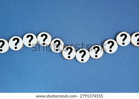 A circular sequence of papers with a question mark icon or symbol. the concept of a question or problem. Q and A. human resources concept