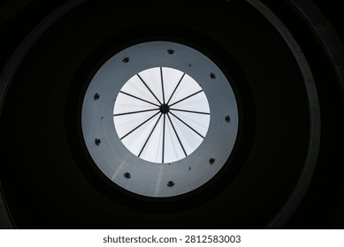 A circular skylight with radial lines in a ceiling in Daliang, Guangdong, China.