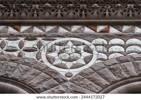 Circular stone decoration. Colonial architectural feature or detail in Old City Hall Building (1898), Toronto, Canada