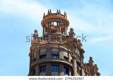 The circular superstructure in the style of a classical temple of the Edifici de Sindicats in Barcelona, Spain   