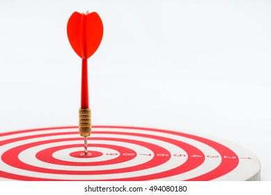 Circular target marked with numbers and red dart. An idea of targets i.e business, price, audience, market, group, practice, analysis, risk, range, rate, state, tracking, area, value, cost, site, etc.