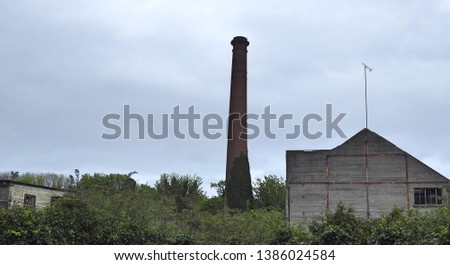 Circular-profile chimneystack, built c. 1860. Red brick walling with tapering shaft, in Yellowbatter, Drogheda. 