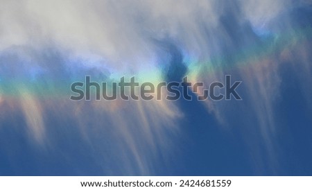 Circumzenithal arc seen in Curitiba, formed by refraction of sunlight on oriented hexagonal plate ice cristals. The colors of such arc are pure and spectral.