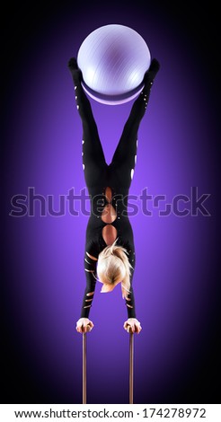 circus actor standing on the hand on a blue background