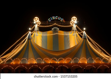 Circus tent at night with its colorful lights on