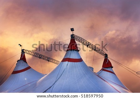 Circus tent under the  dramatic sunset sky 