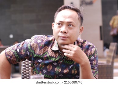 
cirebeon, september 26 2019, photo of a man posing with a serious face wearing a batik shirt