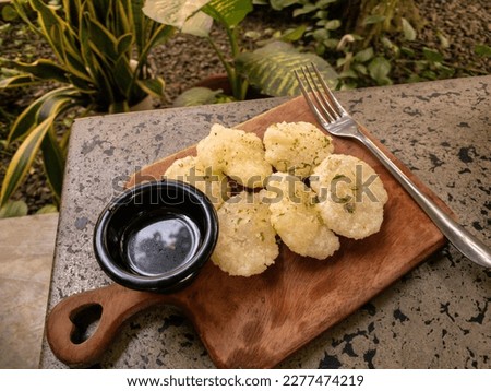 cireng, a savoryy snack from west java, Indonesia. made from tapioca flour and deep fried, served with a spicy sauce