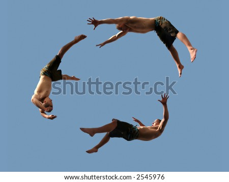 A cirlcle of three flying young athletic men