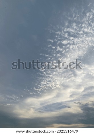 The cirrocumulus spread like cherry blossoms filling the beautiful sky and appearing cumulonimbus clouds at Bangkok , Thailand. no focus