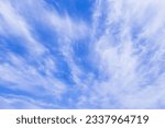 Cirrus clouds like brooms in the blue sky