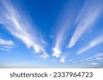 Cirrus clouds like brooms in the blue sky