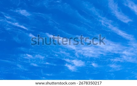 Cirrus and Stratus clouds in dramatic blue sky over Cape Town	