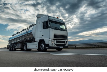 Cistern Tank Truck Close Up On A Highway Road With A Beautiful Dramatic Sunset Sky In The Background