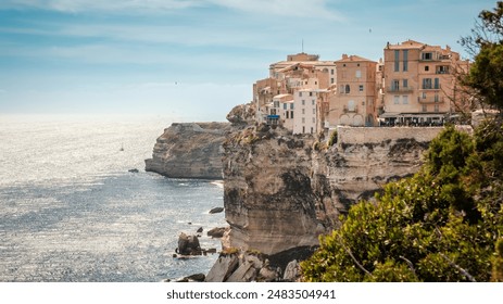 The citadel of Bonifacio in Corsica where houses are perched above the Mediterranean sea on limestone cliffs which have been undercut by the sea and weather - Powered by Shutterstock